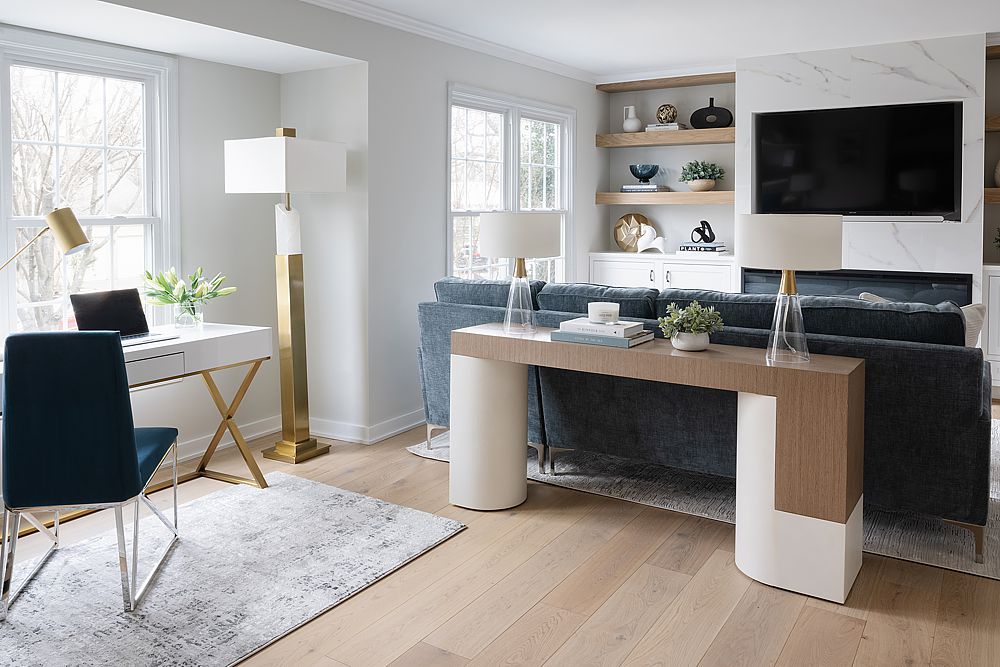 Luxury home office with custom built-in shelving and elegant lighting.